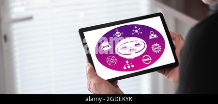Connected cars concept shown on a tablet held by a man Stock Photo