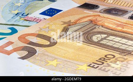 Macro close up on the design surface of 50 euro notes. Banknotes of the European Union. Wallpaper background of money. Detailed currency closeup. Euro Stock Photo