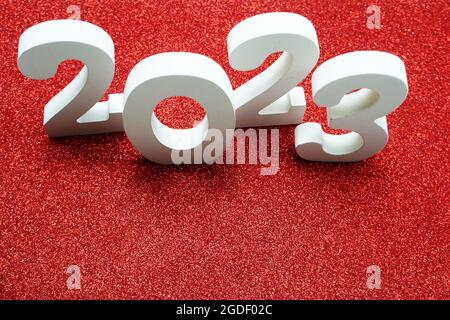 2023 Happy New Year with space copy on red glitter background Stock Photo