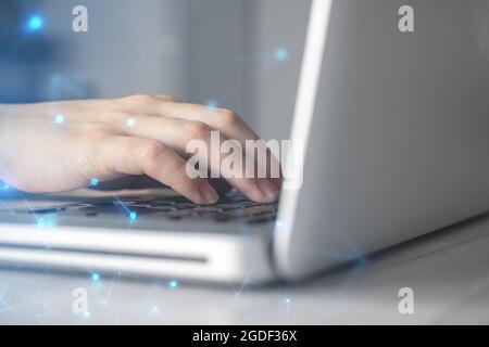 Hands on laptop computer keyboard. Woman working remotely at home. Concept of networking and remote freelance work, global business network Stock Photo
