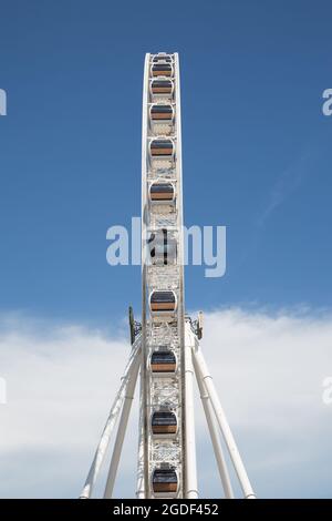 White Ferris Wheel Over Blue Sky in the sunny day, urban landscape ...