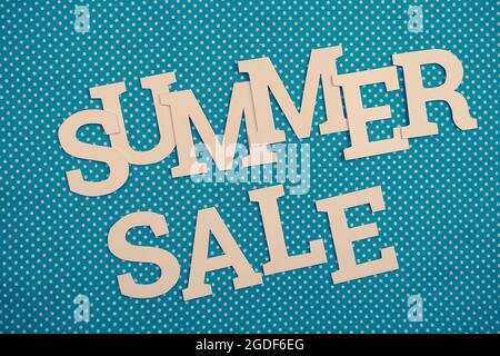 Summer Sale alphabet letters on blue polka dot background Stock Photo