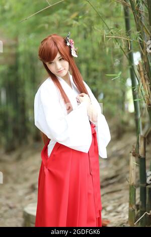 Asian girl portrait , Japanese Miko in nature Stock Photo - Alamy