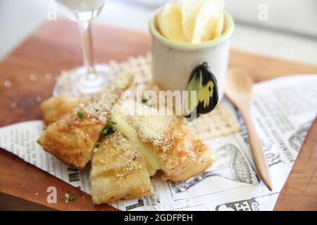 Fusion food roti with cheese and potato chips Stock Photo