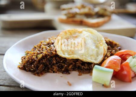 Fried rice nasi goreng with chicken and vegetables Stock Photo