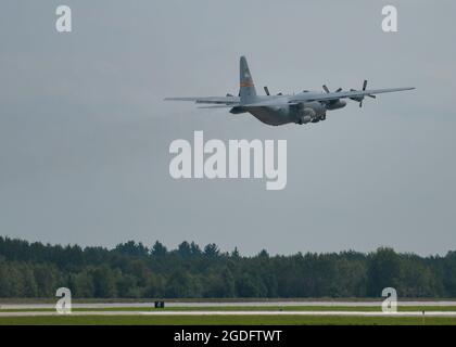 A C-130 Hercules aircraft assigned to the 182nd Airlift Wing, Illinois Air National Guard, takes off from the flightline during Northern Strike (NS) 21-2 at Alpena Combat Readiness Training Center, Michigan, Aug. 11, 2021. NS is one of the Defense Department's largest reserve component readiness exercises, which occurs for two weeks at the National All-Domain Warfighting Center in Northern Michigan. (U.S. Air National Guard photo by Staff Sgt. Valentina Viglianco) Stock Photo