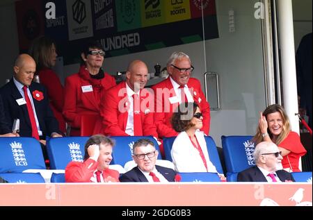 Sir Andrew Strauss (back row, centre) wears a red suit for 'Red for Ruth' day in support of The Ruth Strauss Foundation during day two of the cinch Second Test match at Lord's, London. Picture date: Friday August 13, 2021.
