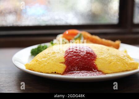 omelette with fried rice and shrimp tempura Japanese food Stock Photo