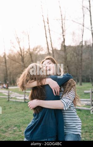 Happy girlfriends in park Stock Photo