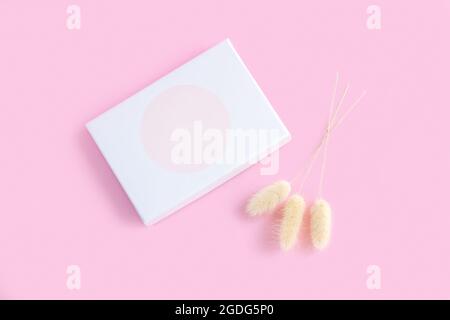 White elegant thin gift box mock-up on pink background top view Stock Photo