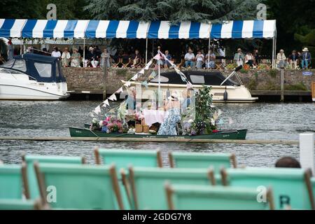 Henley-upon-Thames, Oxfordshire, UK. 13th August, 2021. Lunch on the River Thames. Henley Royal Regatta was in full swing again today on day three. Guests were enjoying watching the rowing and soaking up the atmosphere in the Stewards' Enclosure. Credit: Maureen McLean/Alamy Live News Stock Photo