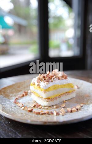 Mango cake with bean on wood background Stock Photo