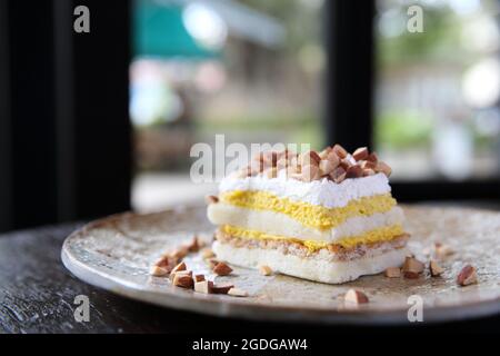Mango cake with bean on wood background Stock Photo