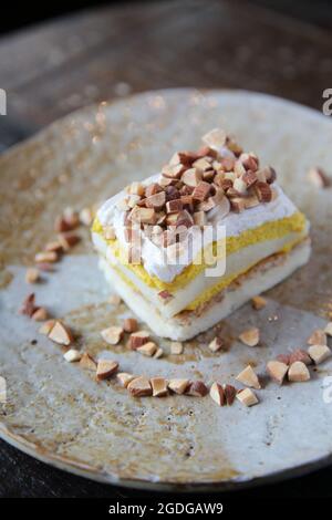 Mango cake with bean on wood background Stock Photo