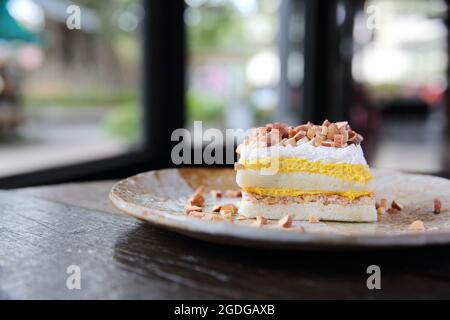 Mango cake with bean on wood background Stock Photo