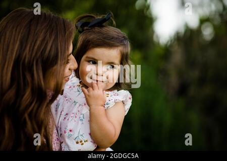 Close Up of Mother Holding One Year Old in San Diego Stock Photo