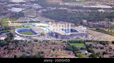 Manchester, UK, 13th August, 2021. Manchester, Trafford, Greater Manchester, and district seen from the air. Etihad Stadium home of Manchester City Football club or MCFC. Credit: Terry Waller/Alamy Live News Stock Photo