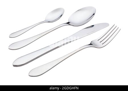 Stylish stainless steel cutlery set with fork, knife, spoon, and teaspoon isolated on white with clipping path. Stock Photo