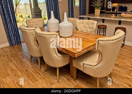 Modern Dining Room Table With Centerpieces Stock Photo