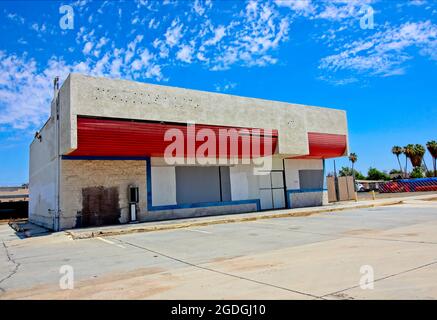 Old Abandoned Commercial Building With Blocked Out Windows Stock Photo