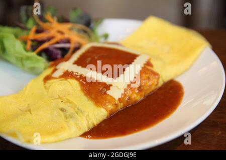 Flavored Fried Rice in an Omelet Wrapping Stock Photo