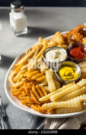 Homemade Crispy Deep Fried French Fry Platter with Dipping Sauces Stock Photo