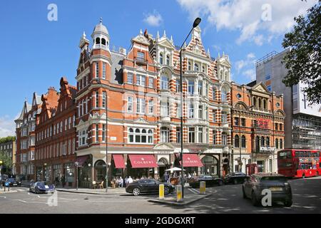 Sloane Square, Chelsea, London, UK. Shows the Colbert Building (centre) and Royal Court Theatre (right). Renouned as London's most affluent district. Stock Photo