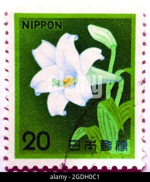 An old used postage stamp printed in Japan shows White Trumpet Lily Lilium longiflorum, Fauna, Flora and Cultural Heritage series, circa 1982, Amaryll Stock Photo