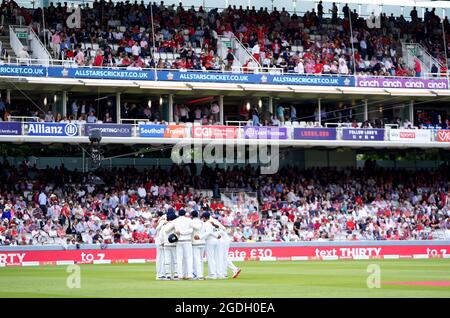 England's players form a huddle before the start of the the fourth T20