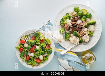 Healthy salad meals with cooked vegetable and fresh lettuce salad. Healthy vegetable diet meal. Stock Photo