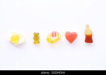gummy candy with cola heart egg ring bear isolated in white background Stock Photo