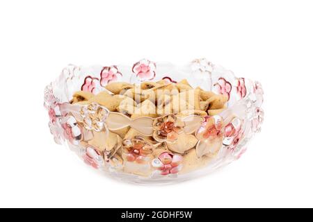 Corn pads in a large plate. Portion of cookies on white background Stock Photo