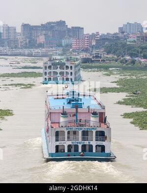 Local Passenger ferry returning to Dhaka river port. Ferry is a very important means of communication with the southern part of Bangladesh Stock Photo