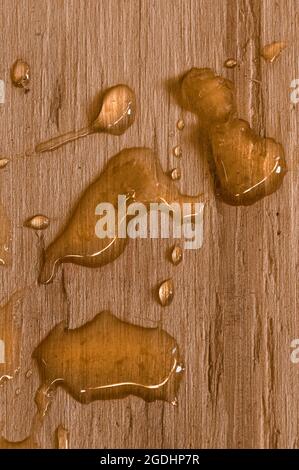 Wet Drips on Wood Background Stock Photo