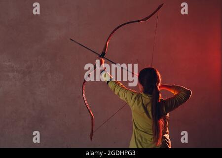 Archer with classic wooden bow and arrow Stock Photo - Alamy