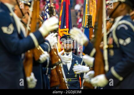 Master Sgt. Jason Prophet, U.S. Air Force Drill Team flight chief, performs a demonstration during the halftime show at the Arizona Cardinals Salute to Service football game, Dec. 1, 2019, in Glendale, Ariz. In addition to the halftime show, the U.S. Air Force Drill Team and Color Guard held the flag during the national anthem. (U.S. Air Force photo by Tech. Sgt. Jensen Stidham) Stock Photo