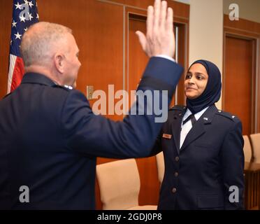 U.S. Air Force Chaplain Candidate Saleha Jabeen is commissioned by U.S. Air Force Chief of Chaplains (Maj. Gen.) Steven Schaick, Dec. 18, 2019 at the Catholic Theological Union, Chicago, Illinois. Jabeen is the first female Muslim Chaplain in the Air Force and Department of Defense. (U.S. Air Force photo/ Tech. Sgt. Armando A. Schwier-Morales) Stock Photo