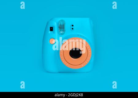 BANGKOK, THAILAND - Aug 05, 2021: polaroid camera Fujifilm Instax mini instant camera on blue color background. Stock Photo