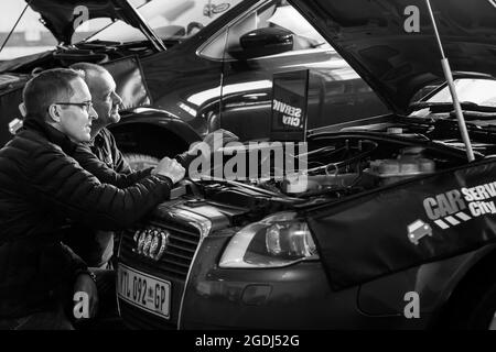 JOHANNESBURG, SOUTH AFRICA - Jan 06, 2021: Two mechanics in a car service city workshop repairing and diagnosing motor vehicles in Johannesburg, South Stock Photo