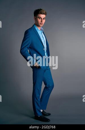 man in a business suit on a gray background Stock Photo