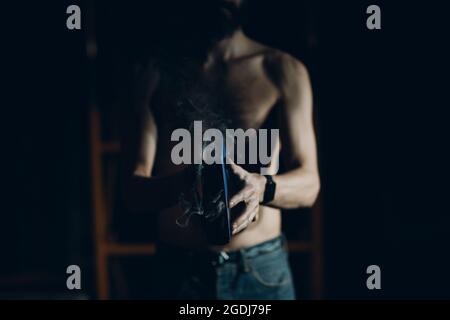 Man hold burning book in his hands Stock Photo