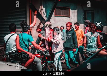 BATAAN, PHILIPPINES - Apr 07, 2017: A group of people on the street during the holy week in the Philippines Stock Photo