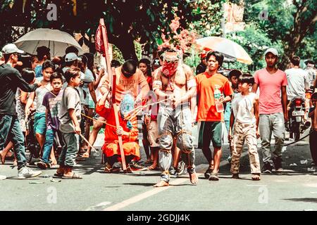 BATAA, PHILIPPINES - Mar 09, 2018: A group of people on the street during the holy week in the Philippines Stock Photo