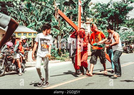 BATAA, PHILIPPINES - Mar 09, 2018: A group of people on the street during the holy week in the Philippines Stock Photo