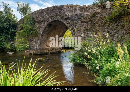 The ancient stone bridge across Badgworthy Water at Malmesmead in the Doone Valley, Exmoor National Park, Somerset, England. Stock Photo