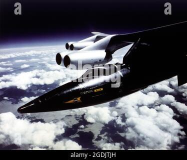 A North American X-15 research plane under the wing of a B-52 prior to launch. Stock Photo