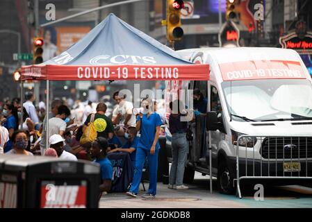 New York, USA. 20th July, 2021. People receive COVID-19 tests at a mobile testing site in Times Square, New York, the United States, on July 20, 2021. Credit: Wang Ying/Xinhua/Alamy Live News Stock Photo