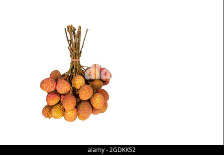 Lychees are bundled together in bunches for sale. White background. Clipping path. Stock Photo