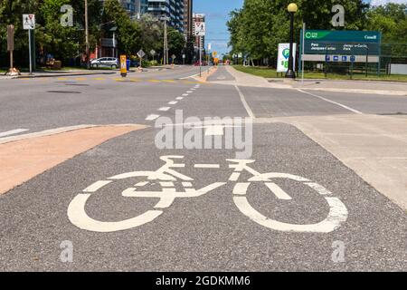 Gatineau, Canada - August 2, 2021: Bike path in the street. Bicycle sign painted on road for cyclists in the city of Gatineau, Quebec Stock Photo