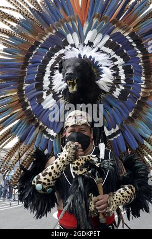 Aztec Ritual Impersonators Mexico City, Mexico . 13th Aug, 2021. Portrait of a person, disguised ...